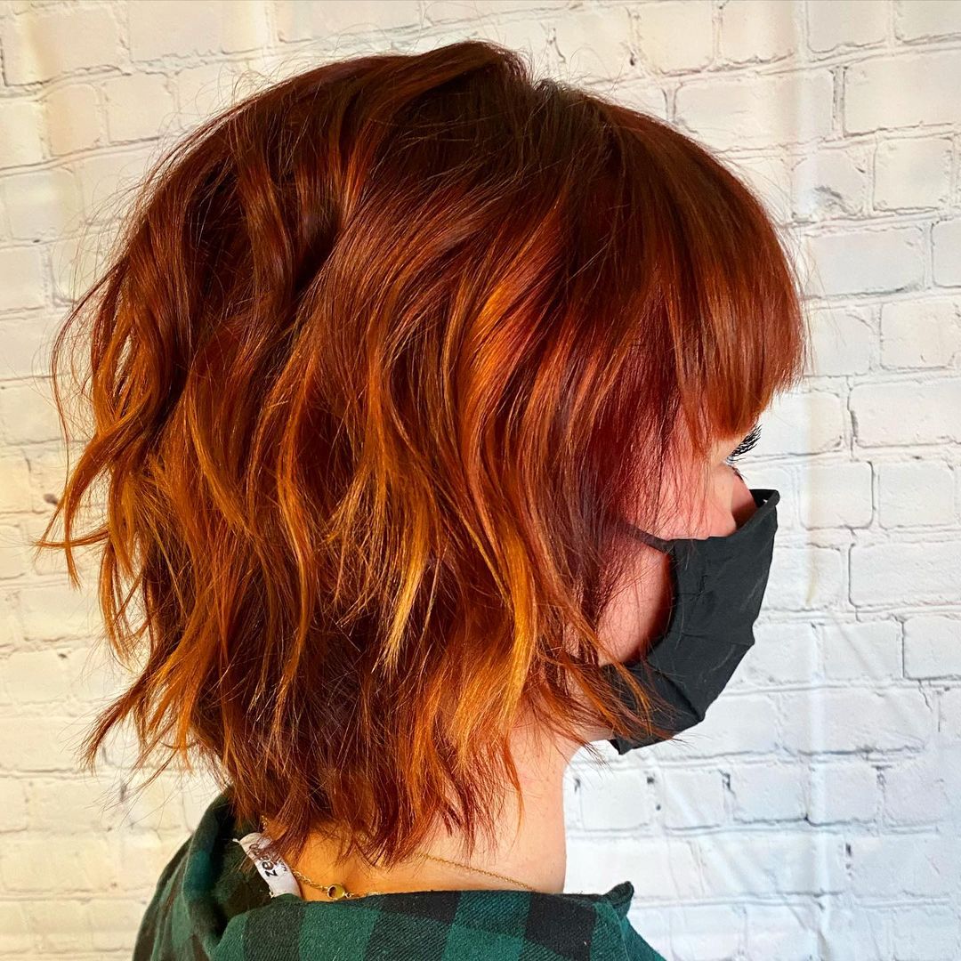 short red hair with bangs and layers