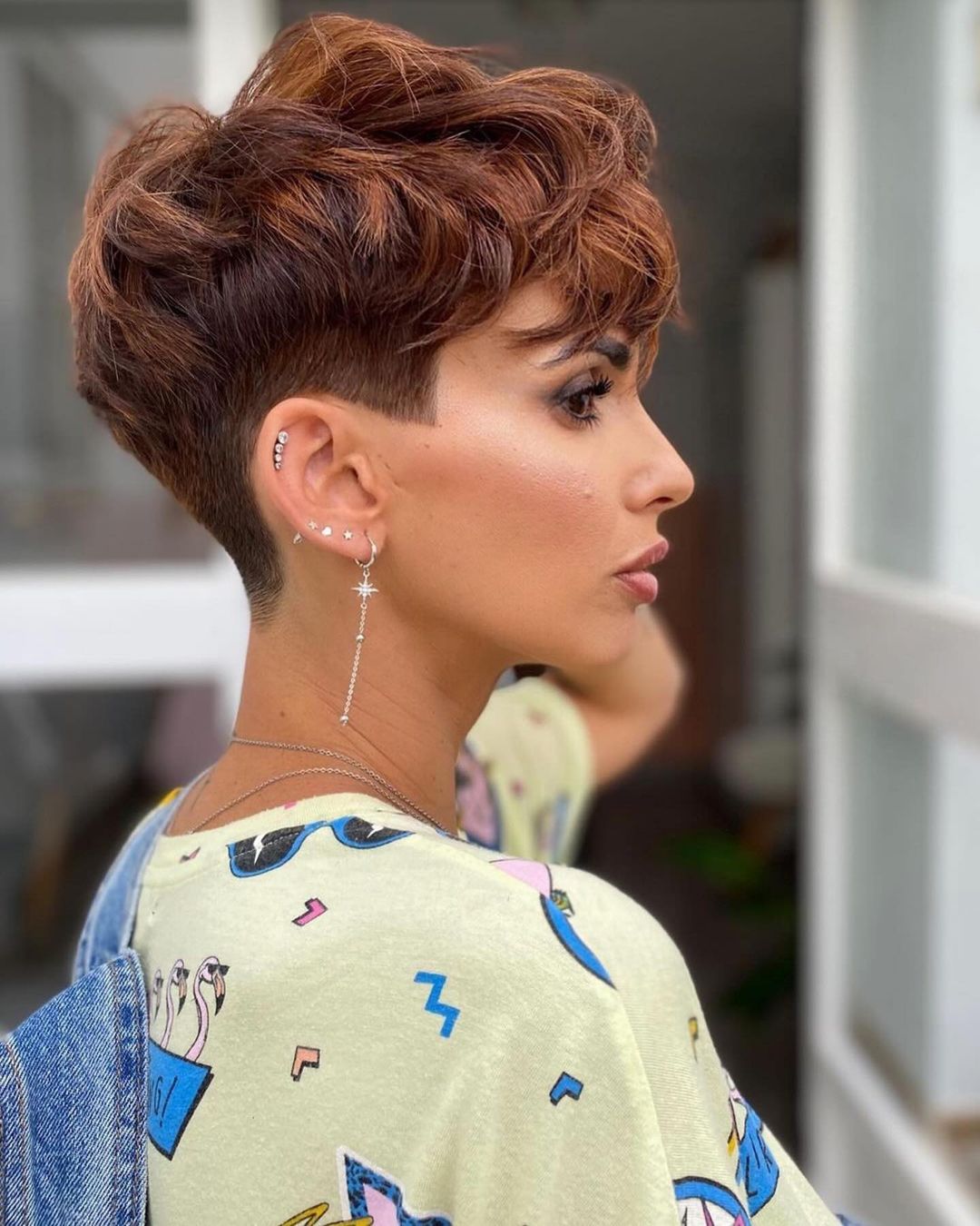wavy pixie cut with a low taper