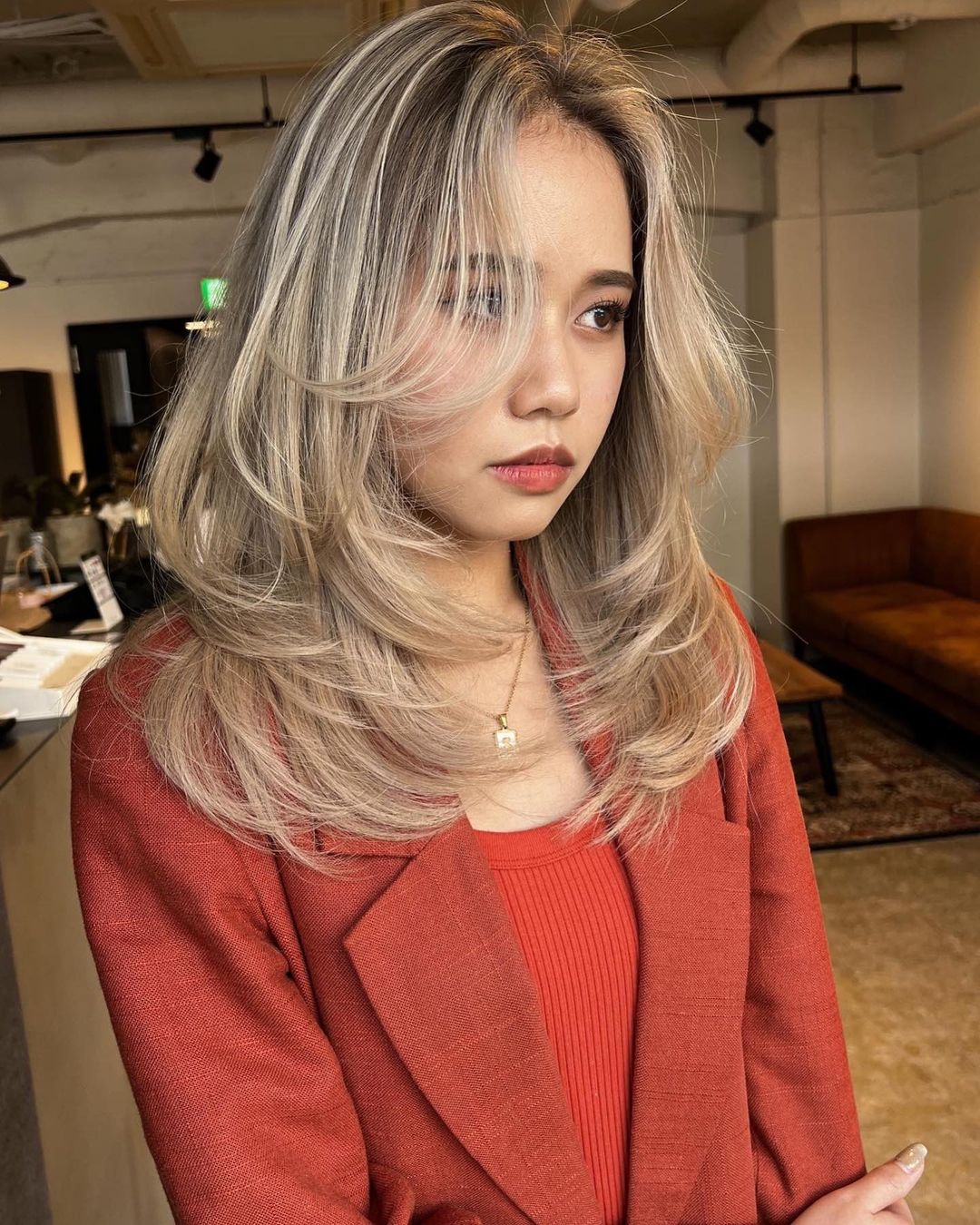 Asian layered hair with blonde highlights