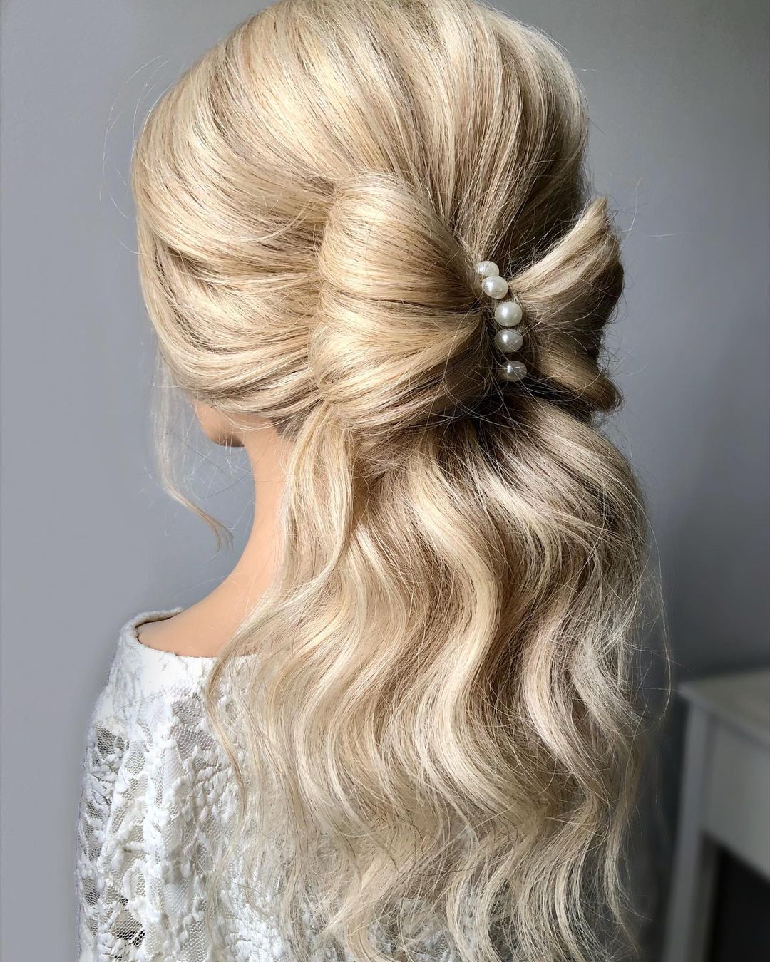 blonde half up bow hairstyle with pearls