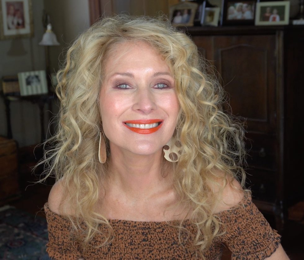 blonde layered curly hair for women over 50