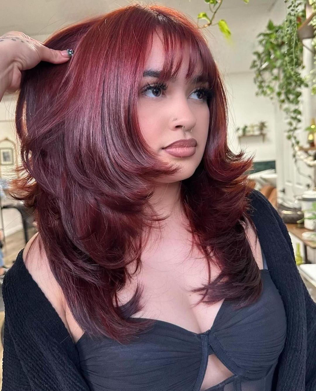 burgundy layered hair with piecey bangs