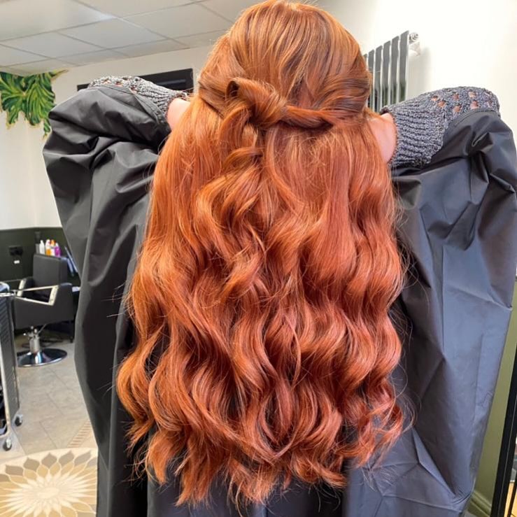 cowgirl copper half-up half-down hairstyle