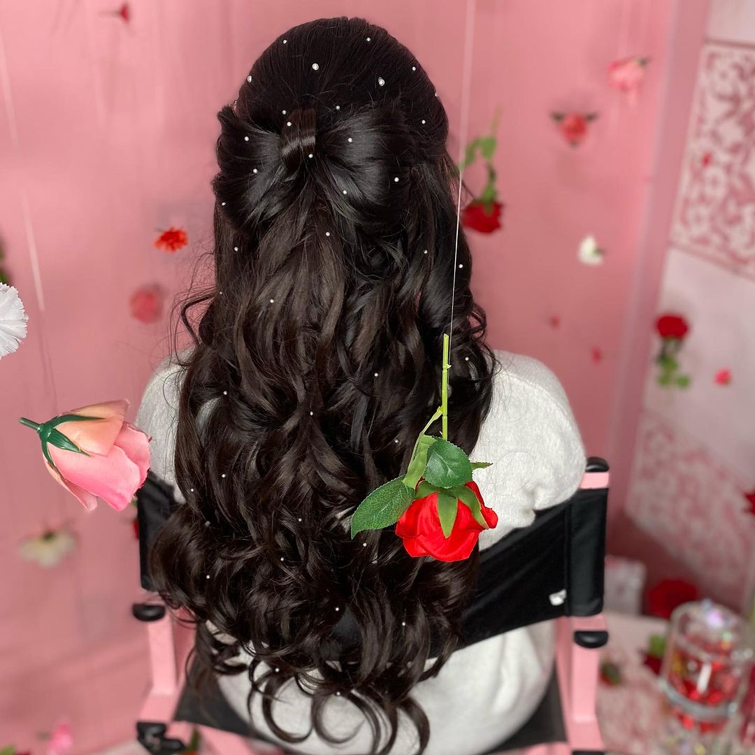 half up bow hairstyle with pearls