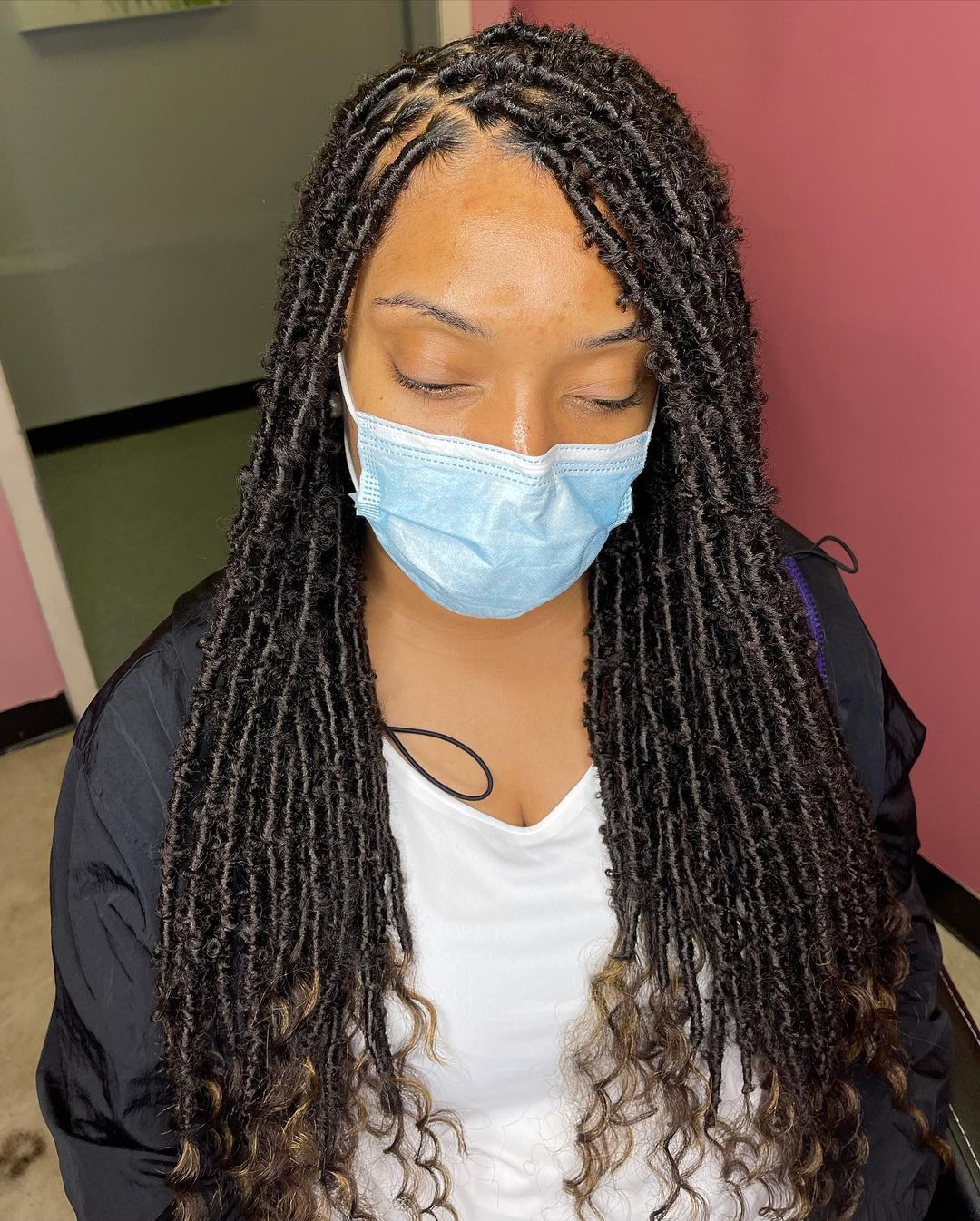 layered island locs with curly ends