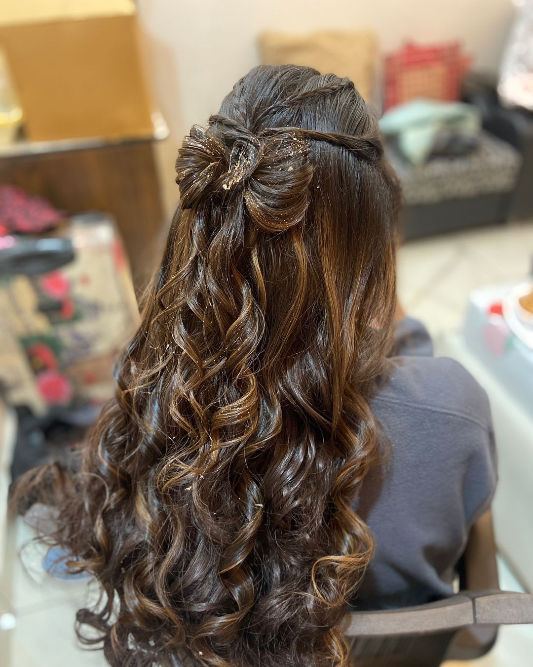 long curly half up bow hairstyle for women