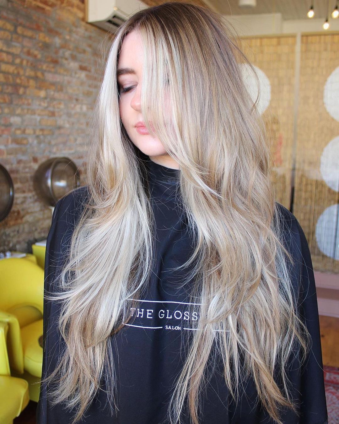 long layered hair with blonde face-framing highlights