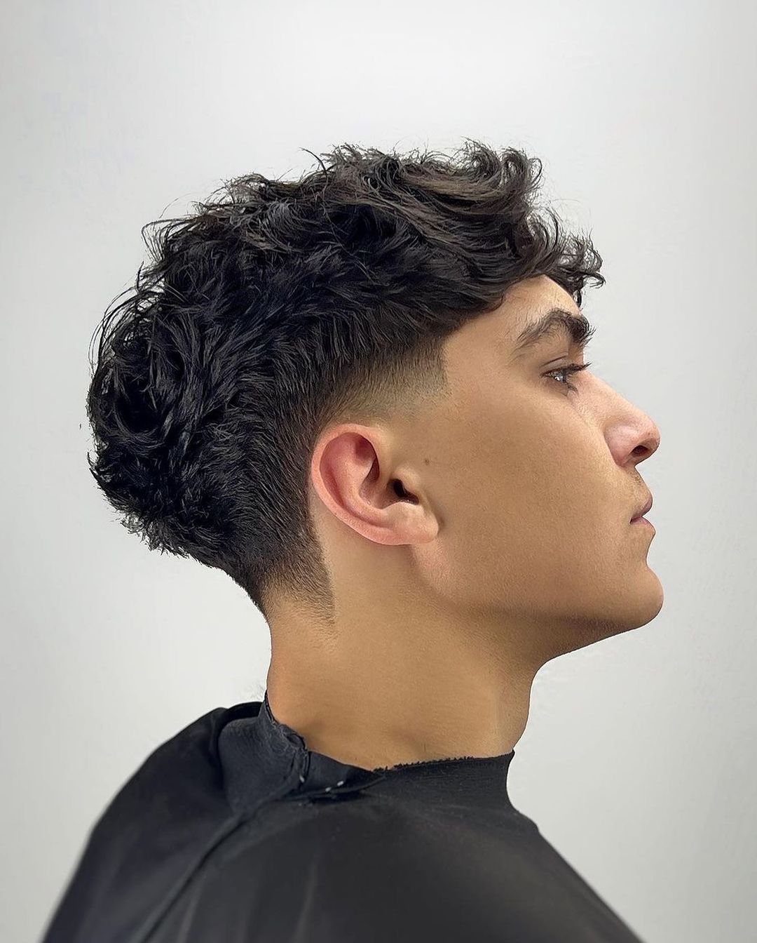 low burst fade textured hairstyle