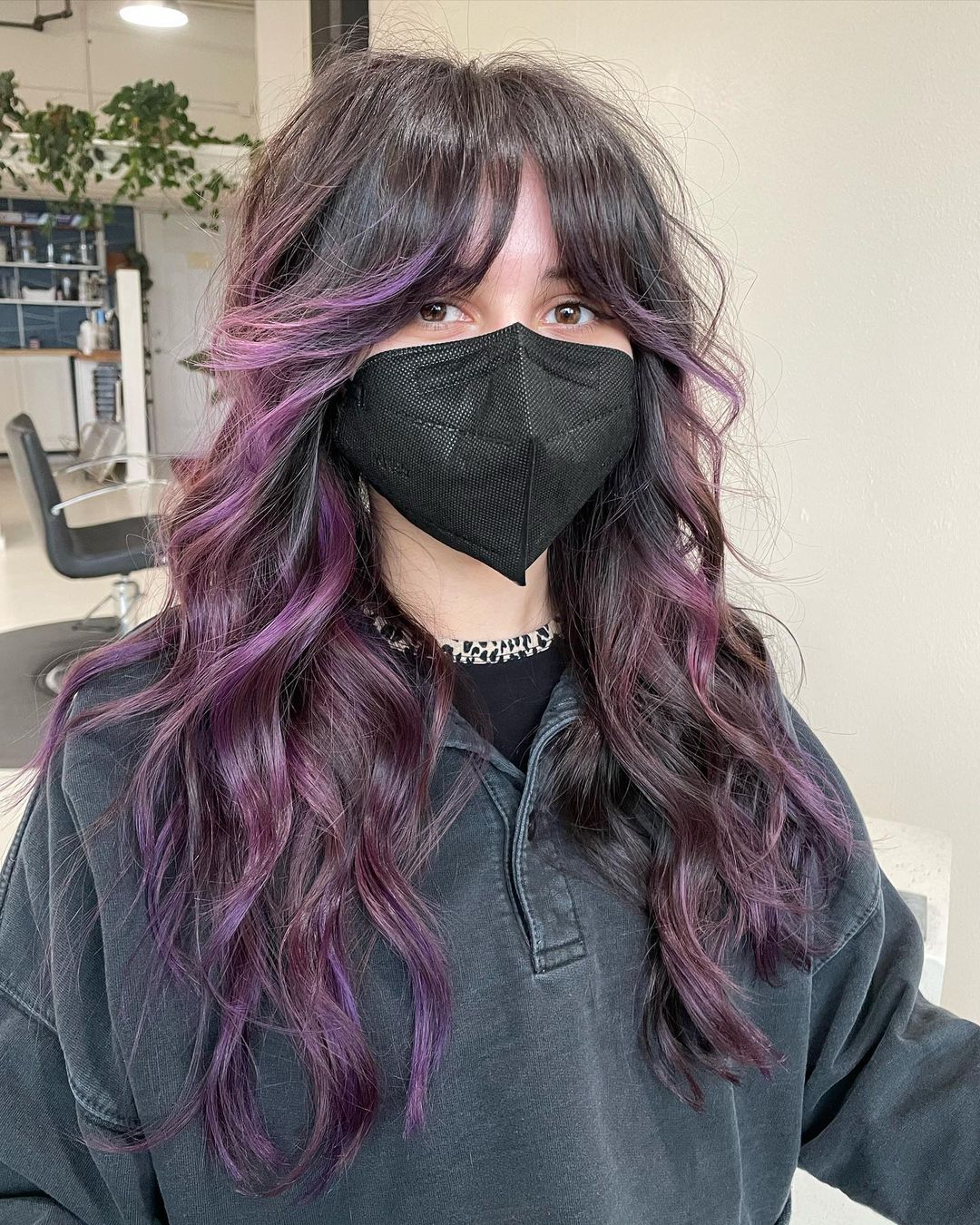 mermaid layers with pastel purple highlights and curtain bangs
