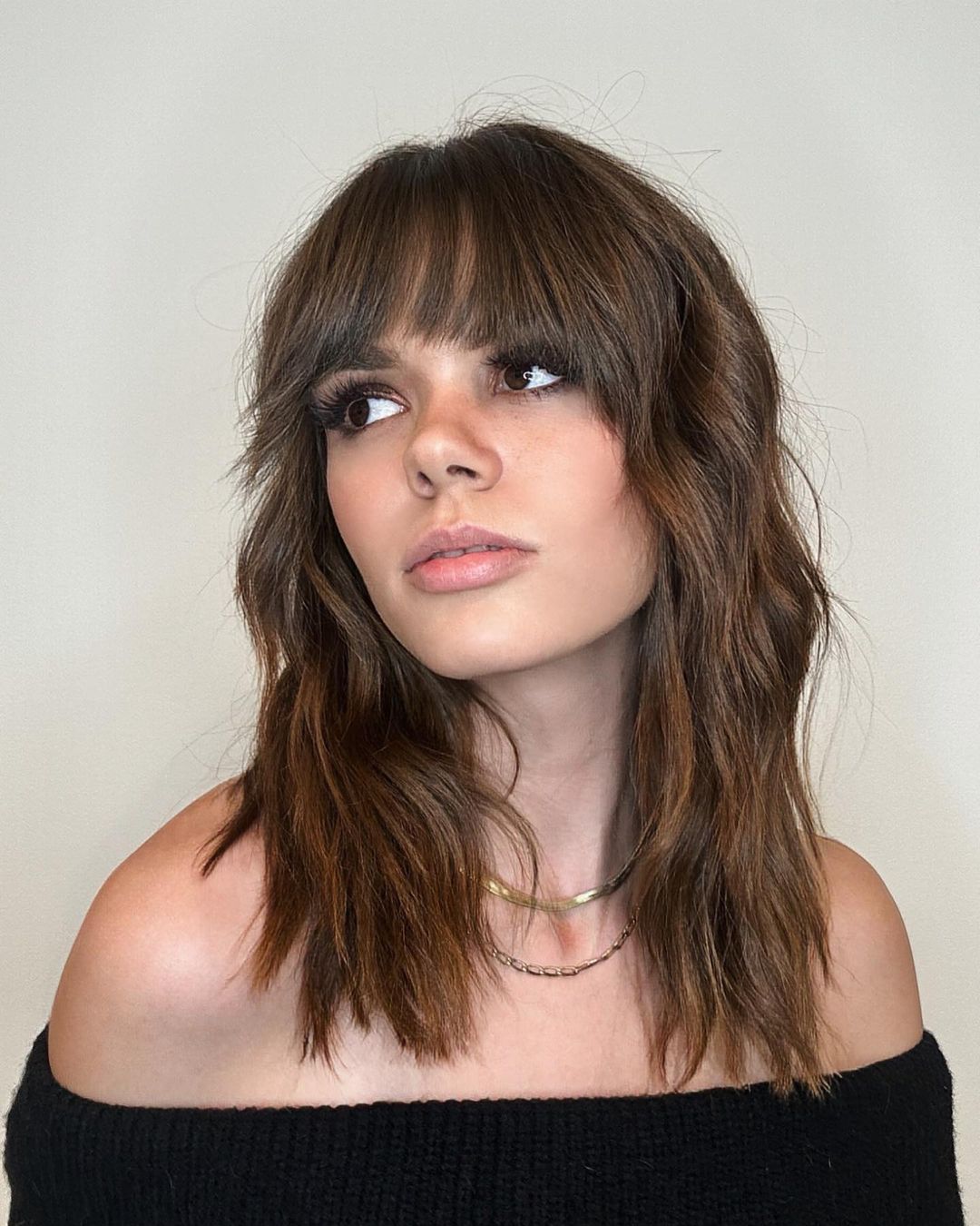 wavy wolf cut with straight bangs