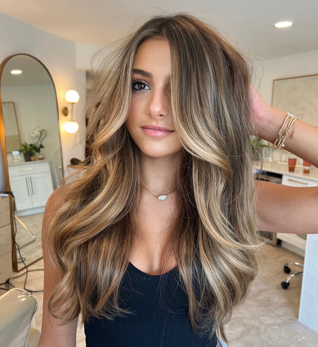 light brown hair with face-framing highlights