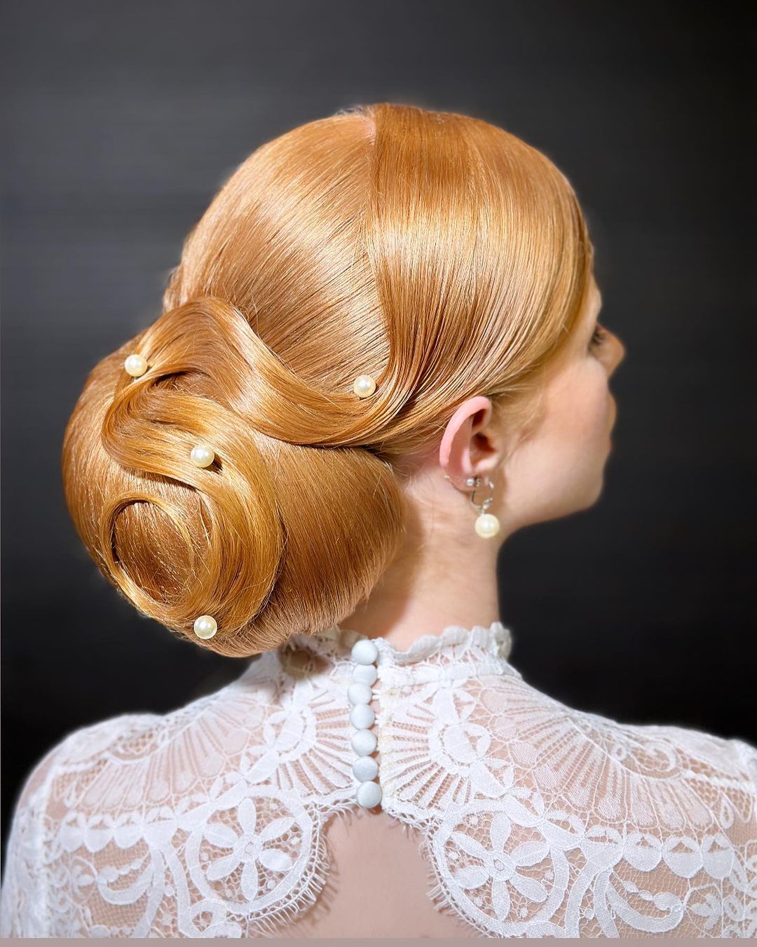 1920's sleek updo style with pearls