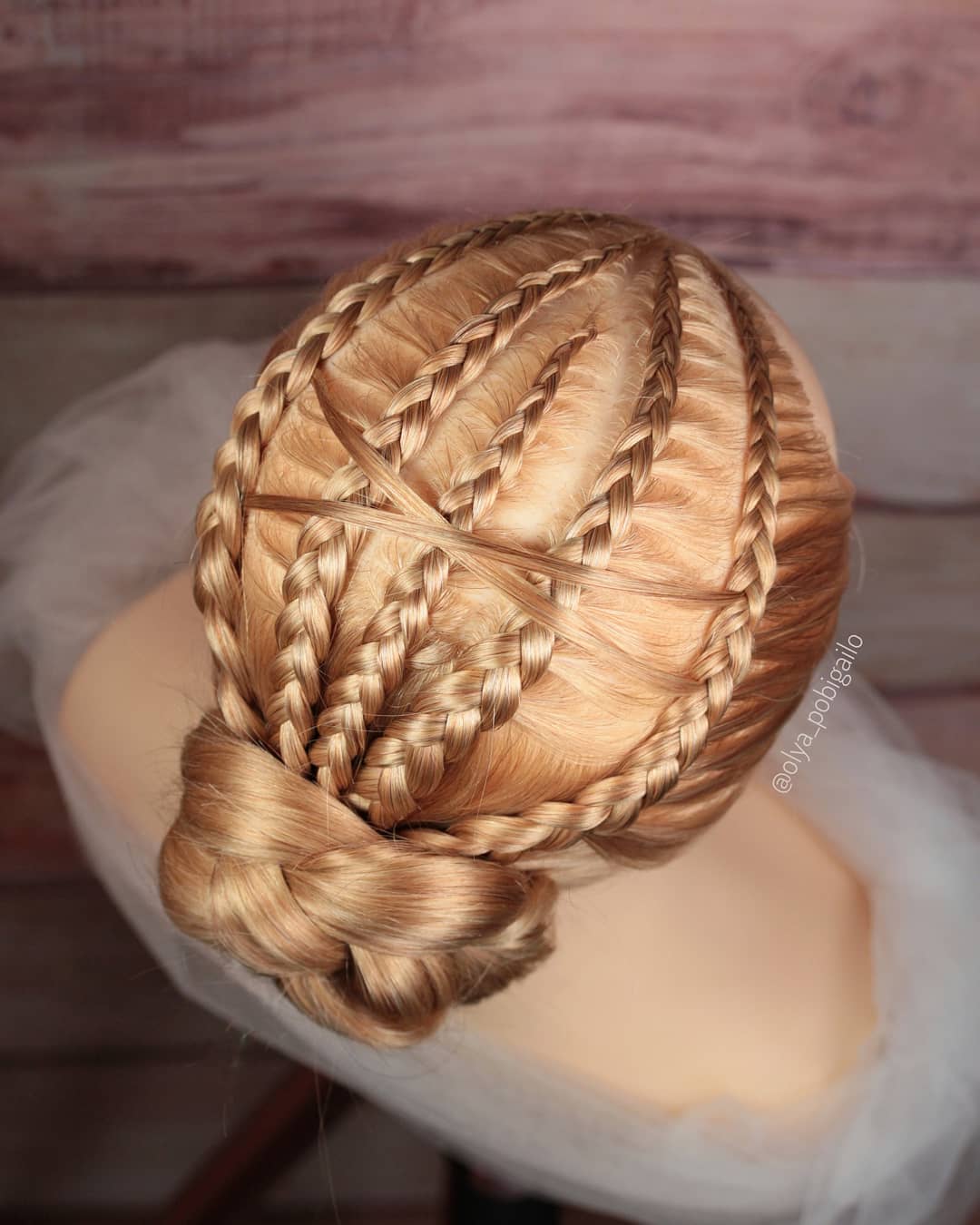 blonde Dutch braids into a braided bun