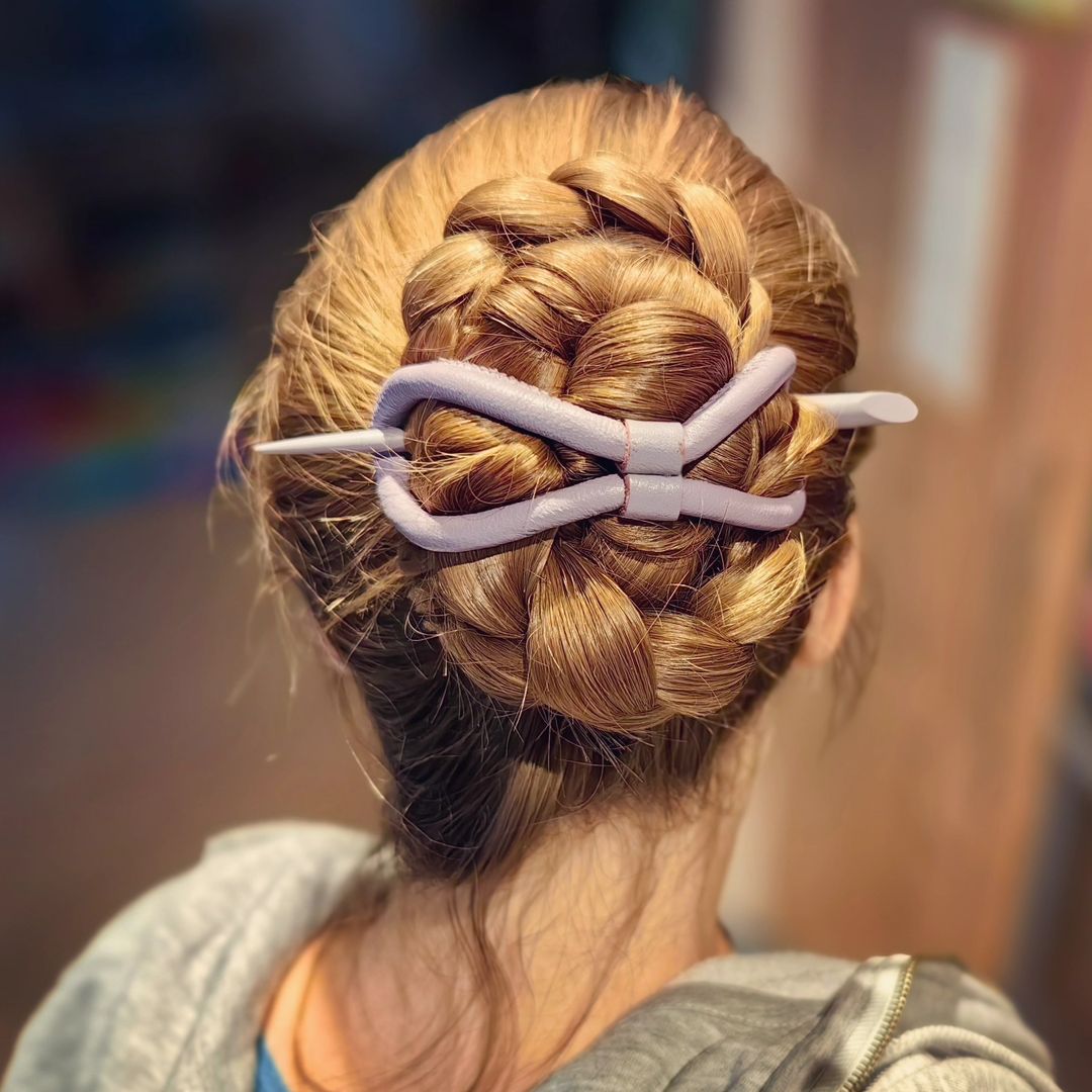 braided bun with a leather flexi 8 hair clip
