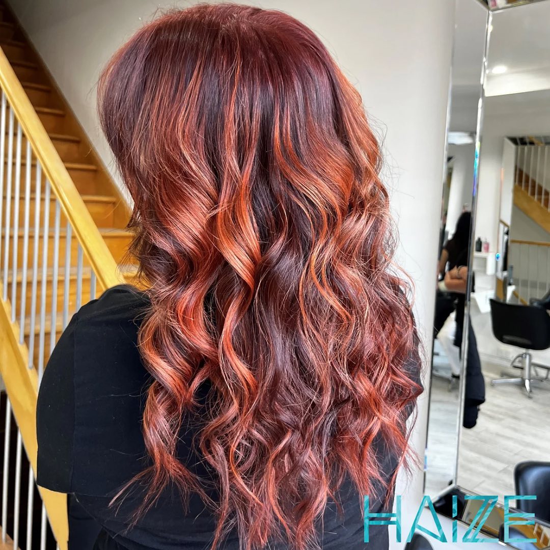 cherry cola with copper highlights long wavy hair