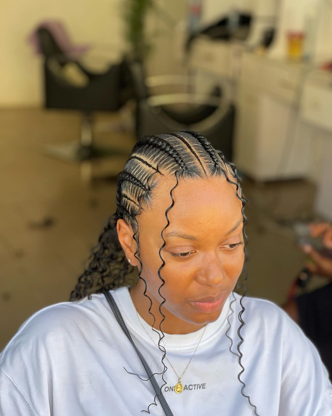 cornrows with face framing curls