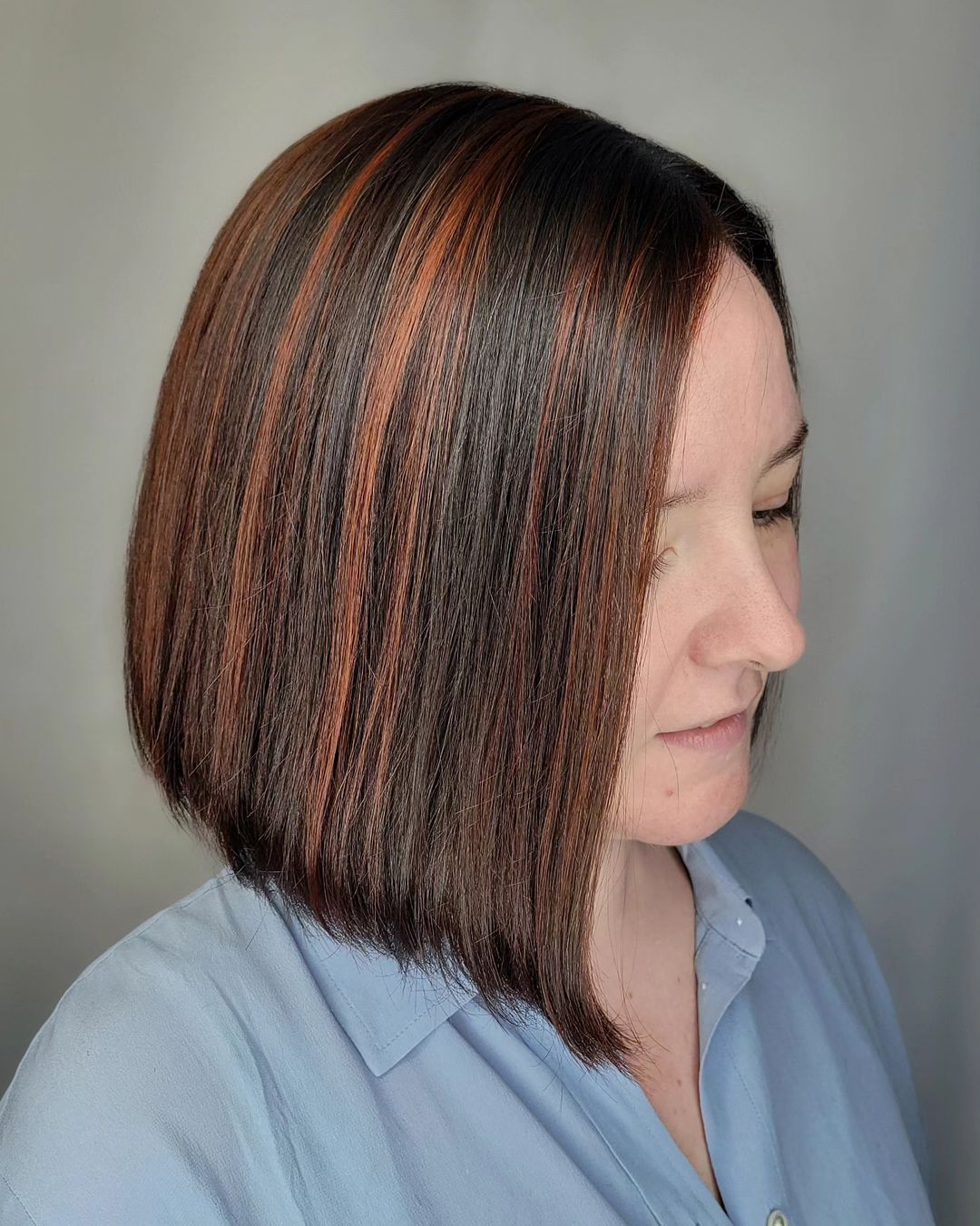 cowboy copper highlights on a short bob hairstyle