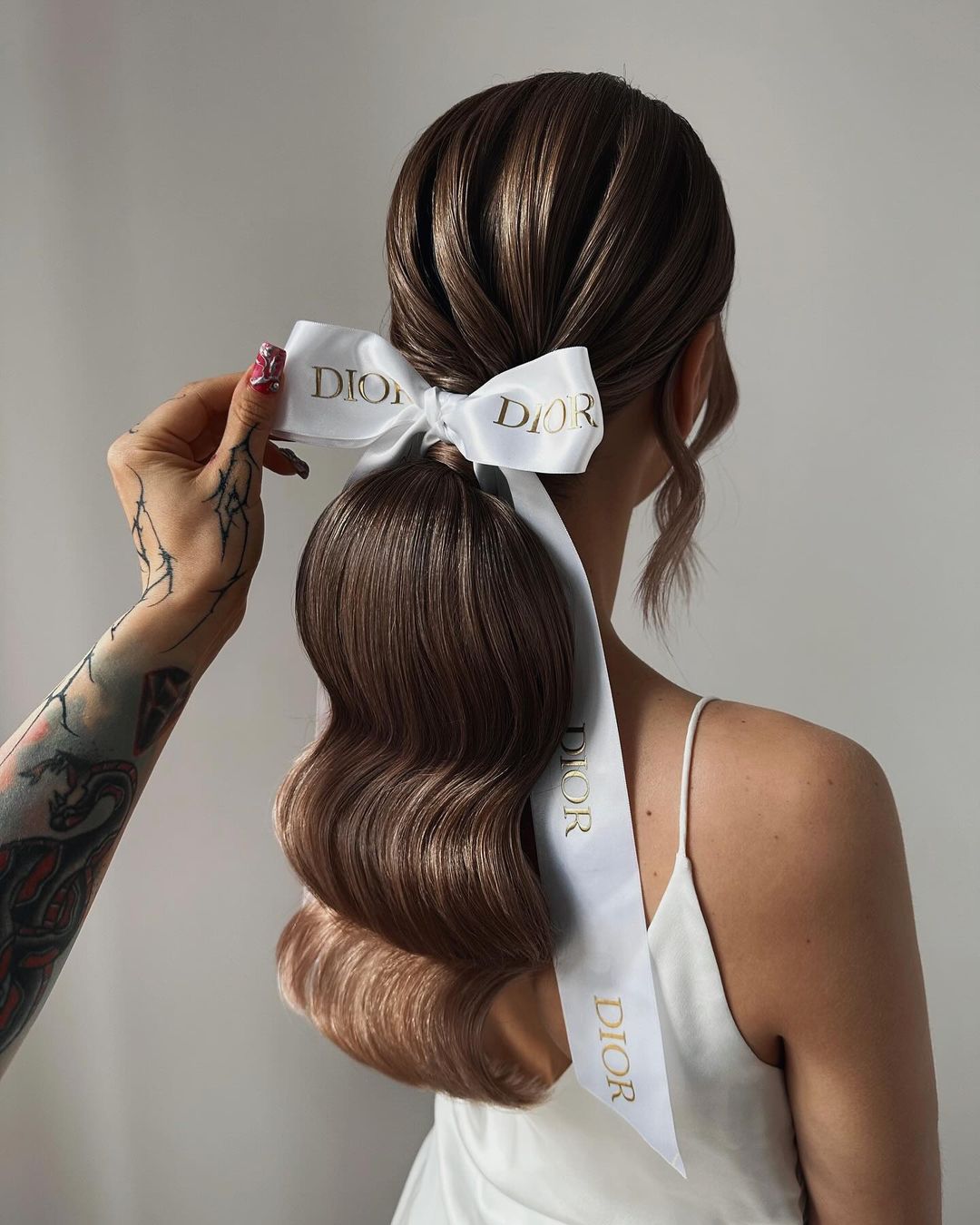 hollywood waves ponytail with a bow