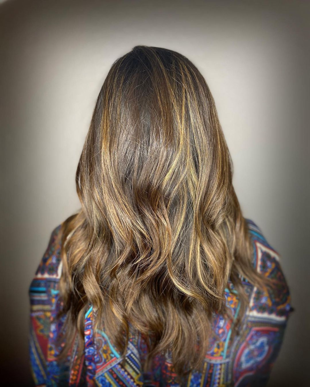 layered brown hair with blonde highlights