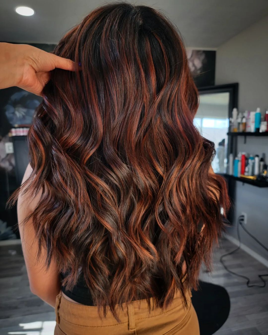 long brown waves with copper highlights
