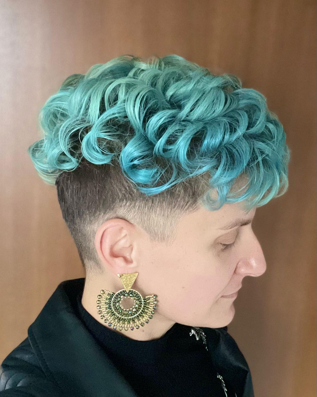 pastel blue curly mohawk with shaved sides