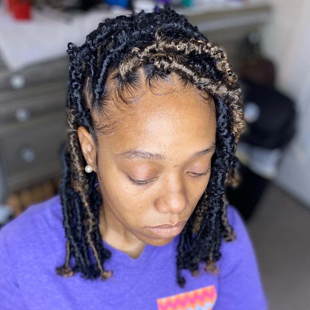 short butterfly locs with a deep side part