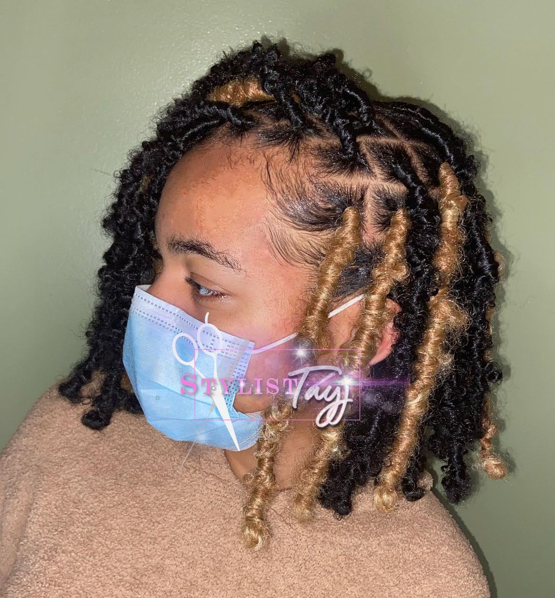 soft locs with copper blonde highlights