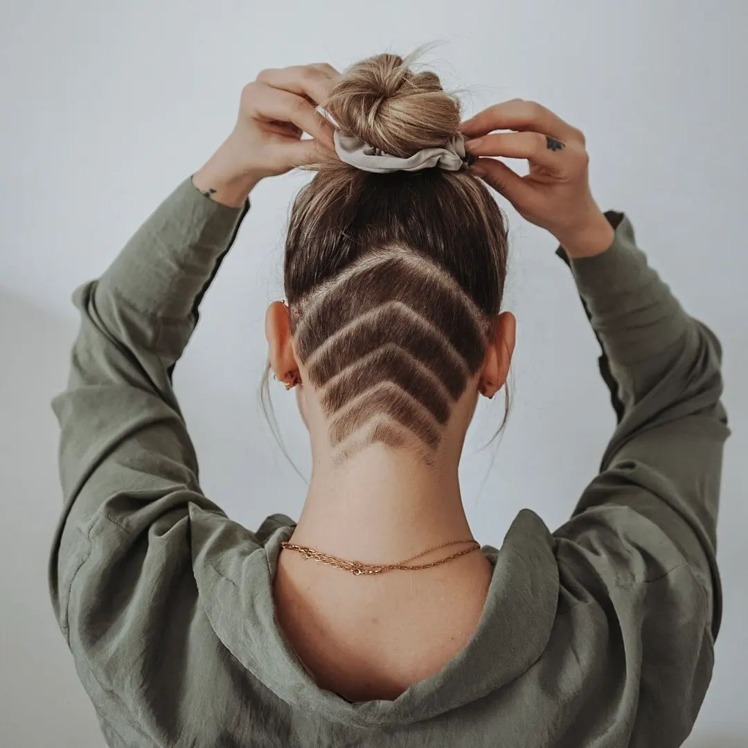triangle nape undercut with a top knot
