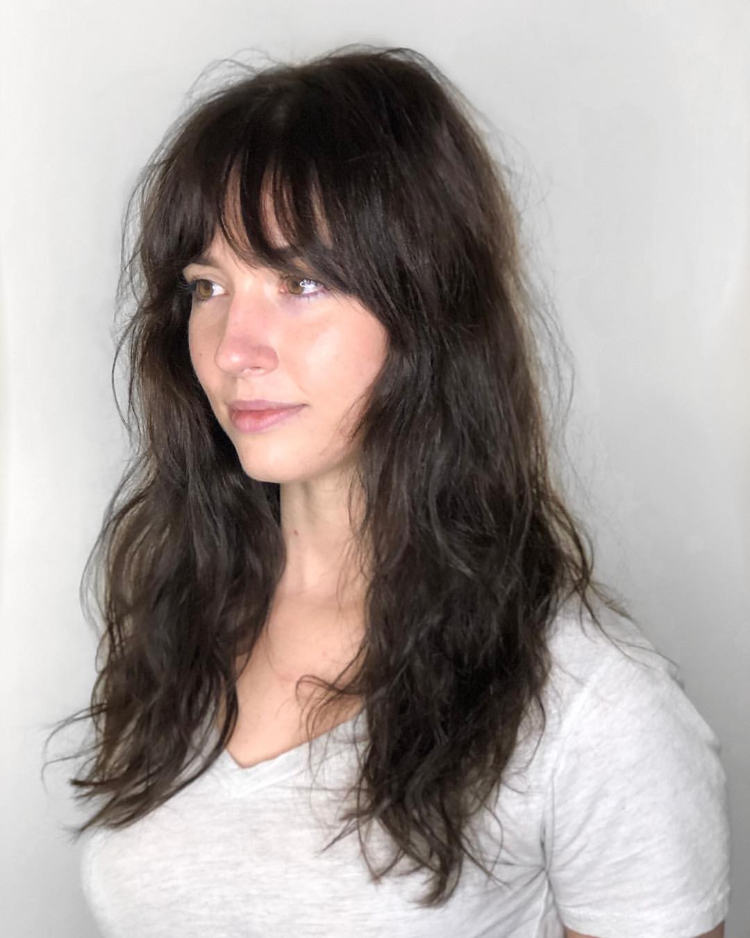 70s beachy hair with french bangs