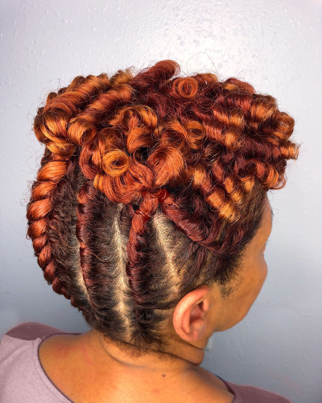 braided hairstyle with curls on top