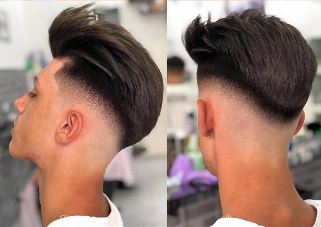 clean fade with brushed up hair