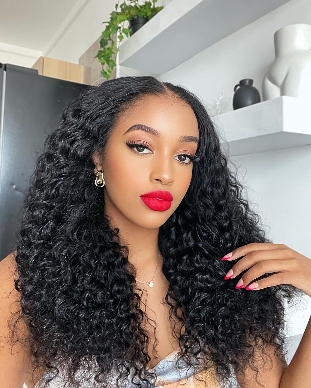 elegant curly hairstyle with a middle part