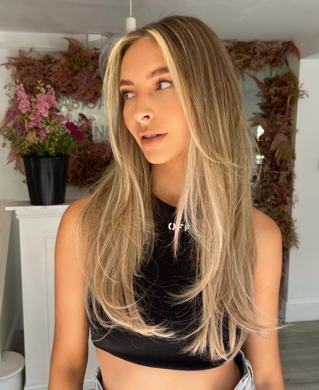 feathered hair with blonde balayage