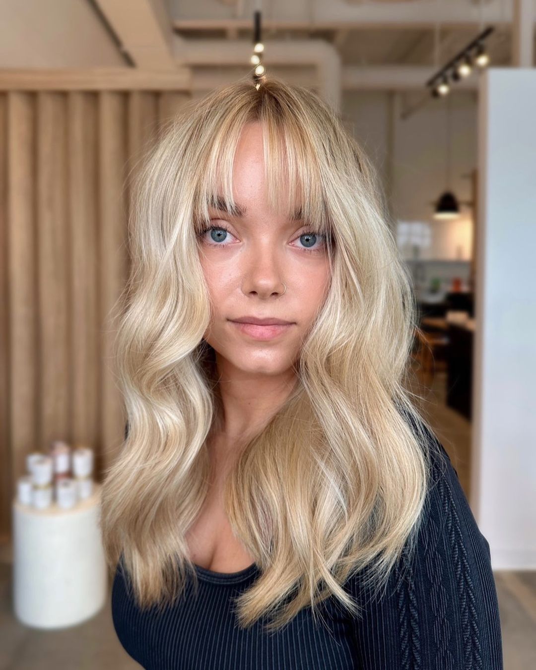 honey blonde hair with french bangs