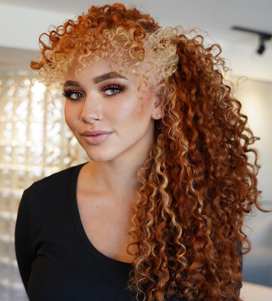 long copper curls with blonde money piece