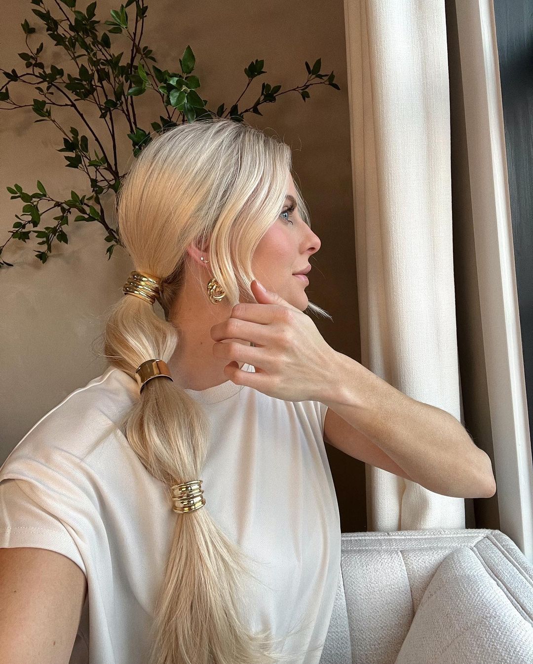 low ponytail with golden hair accessories