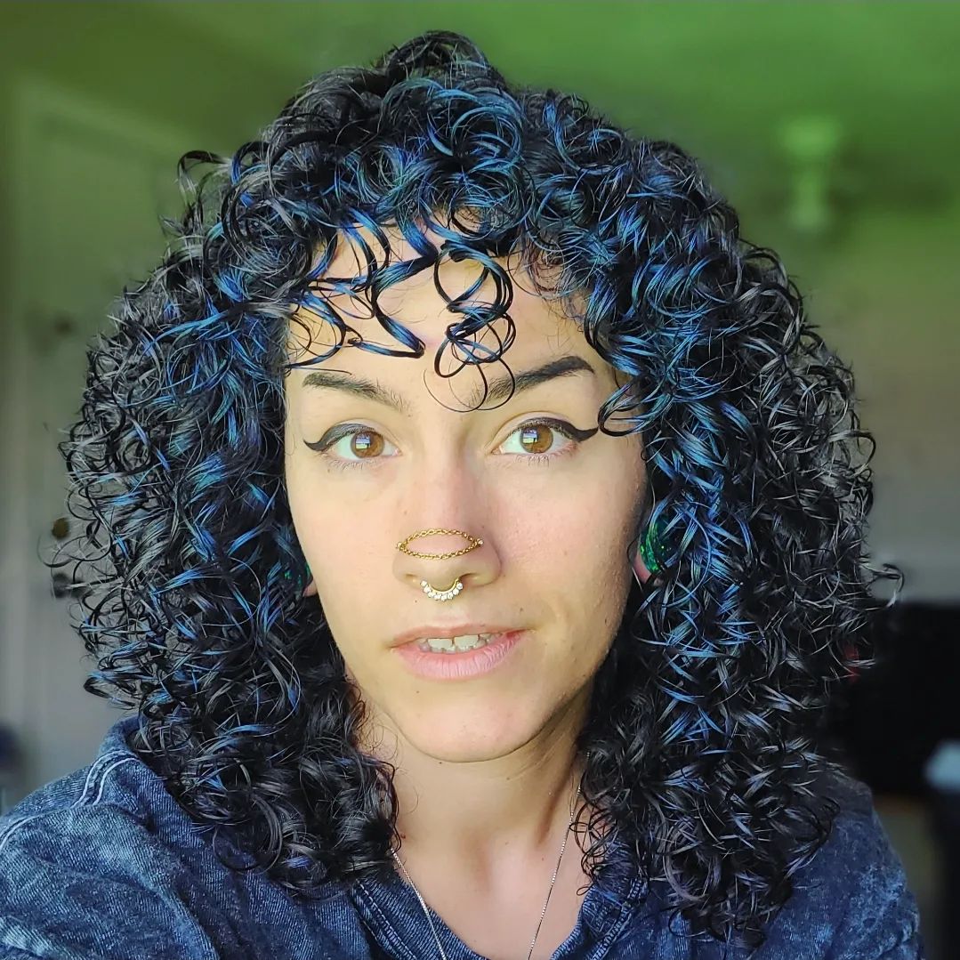 midnight blue money piece curly hairstyle