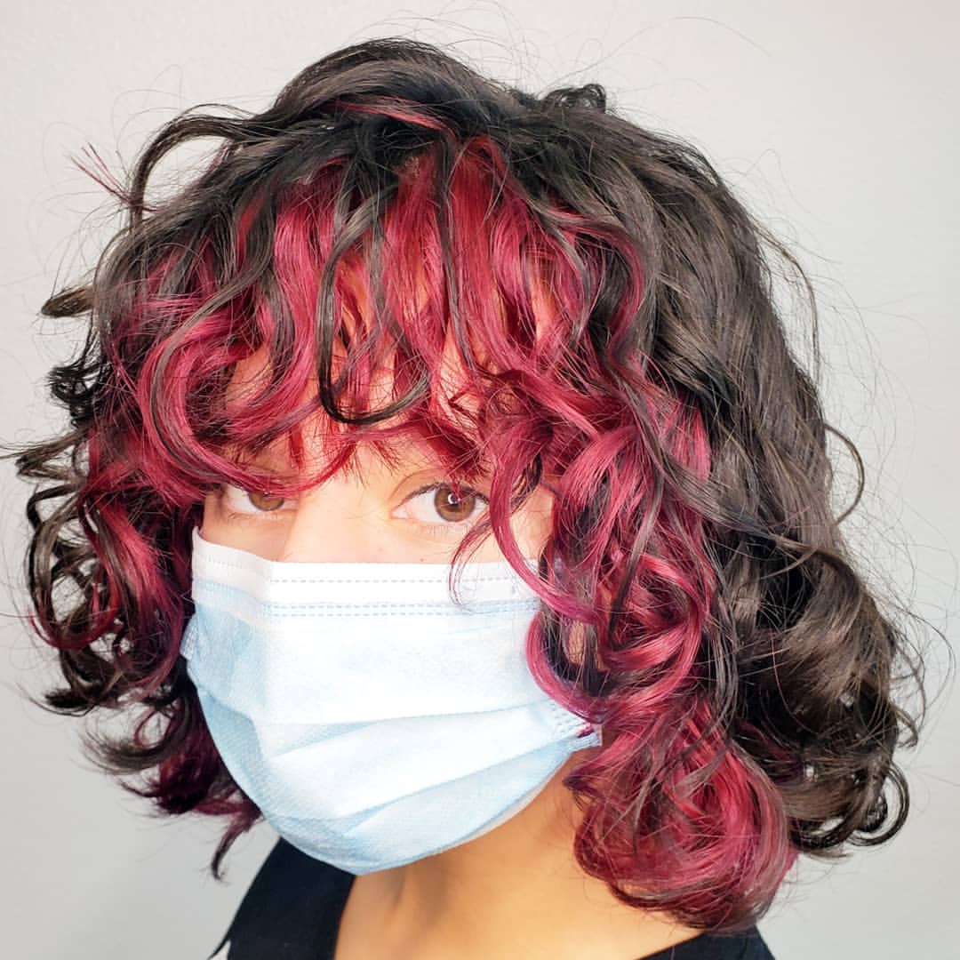 red money piece on short curly bob with bangs