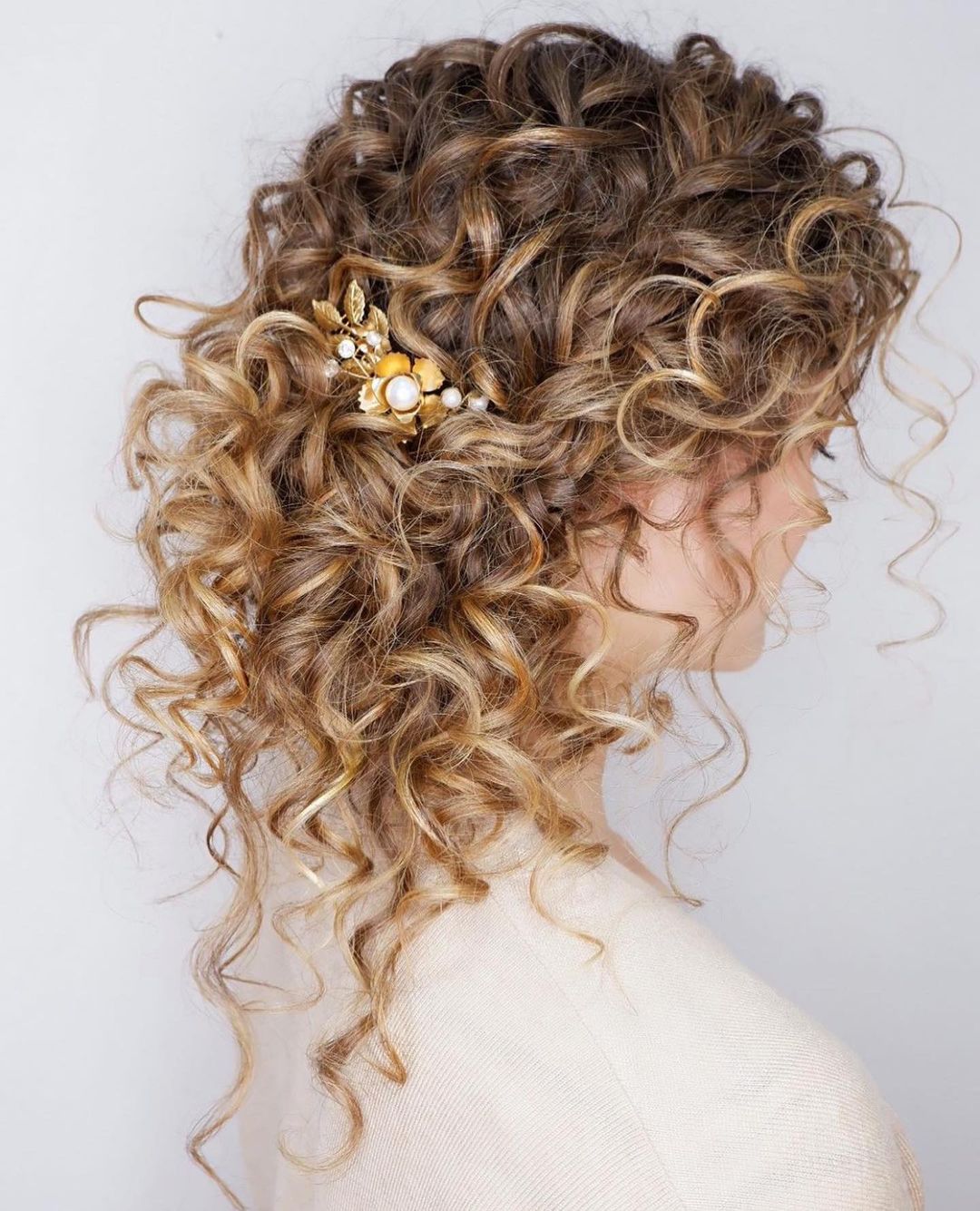 romantic half updo with a decorative hair pin