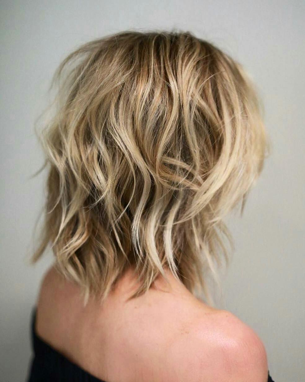 textured modern shag haircut with blonde highlights