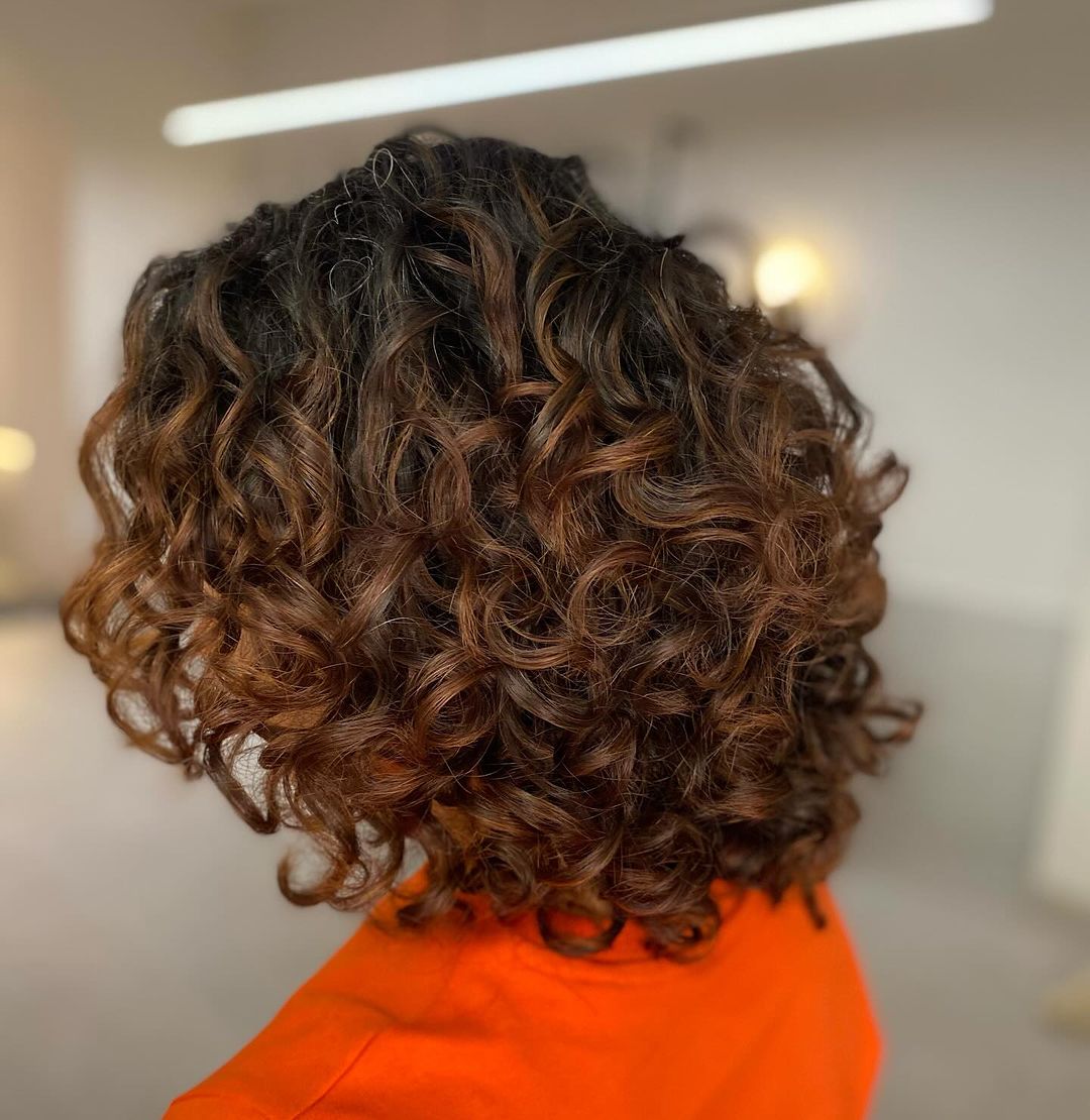 warm brunette curly balayage