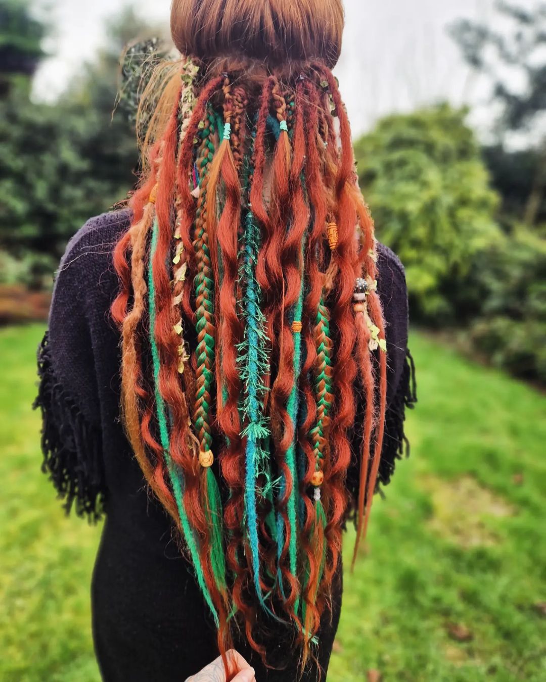 long red copper curls with braids and beads
