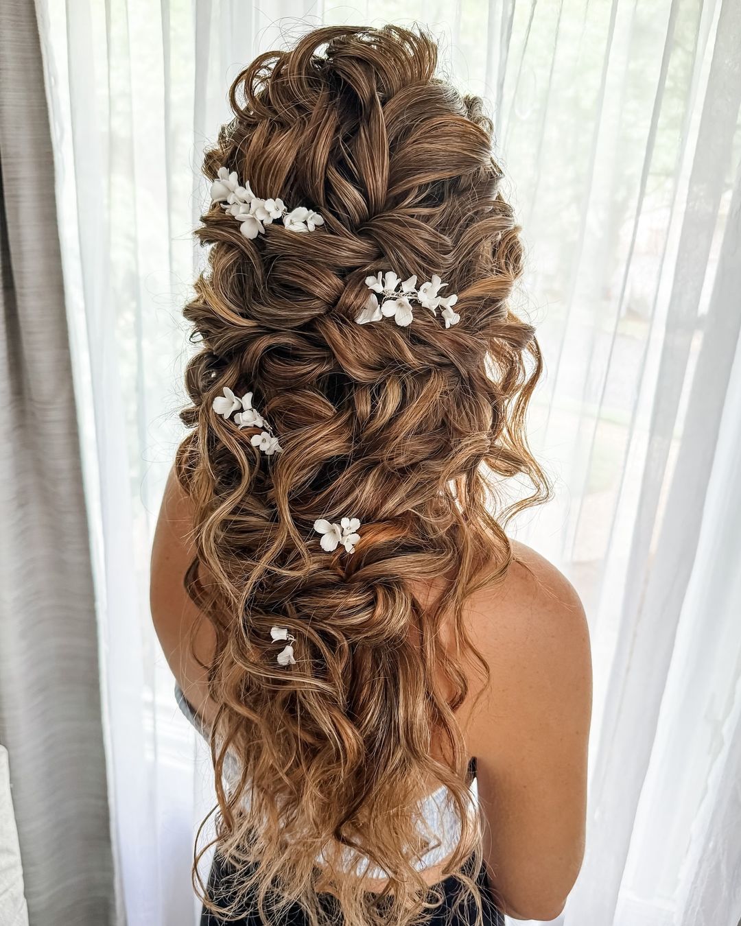 textured mermaid braid with floral hair ornaments