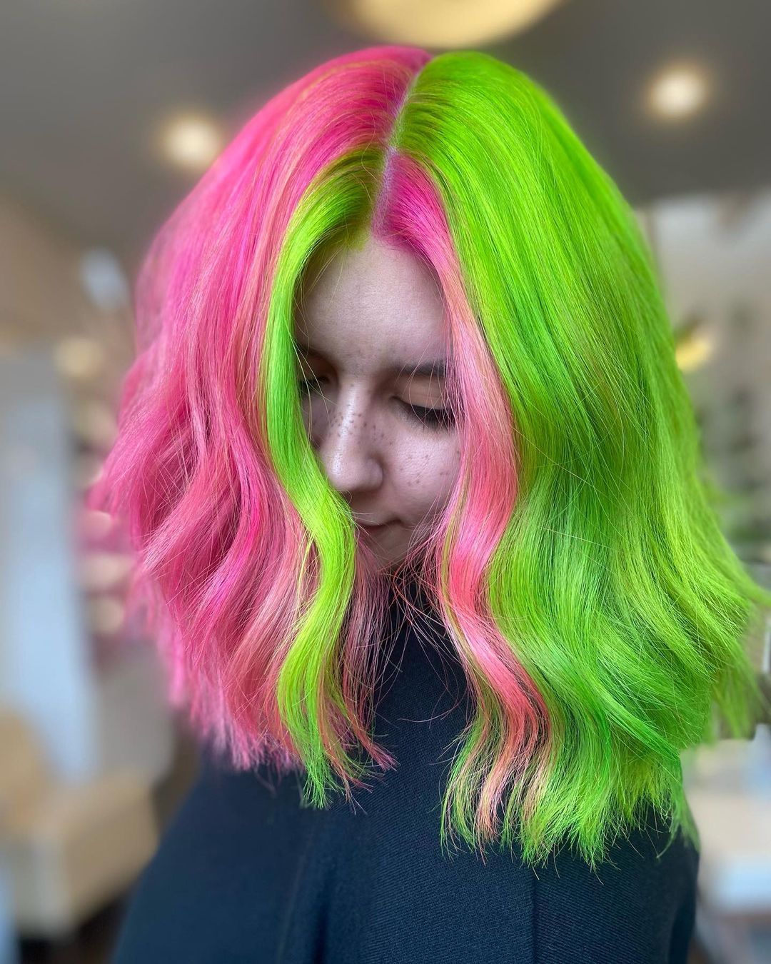 two-toned green pink hair with contrasting money piece