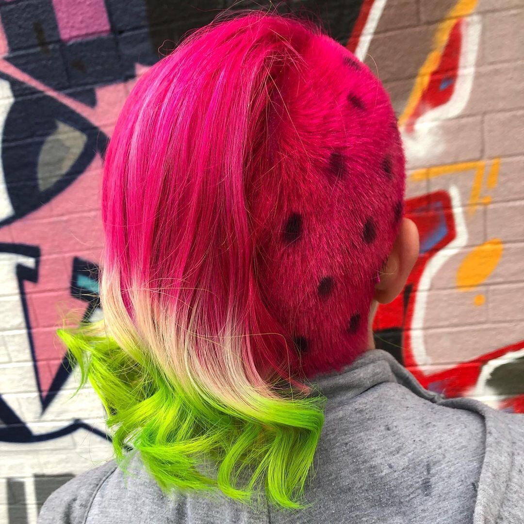watermelon hair with pink side undercut and seeds tattoo