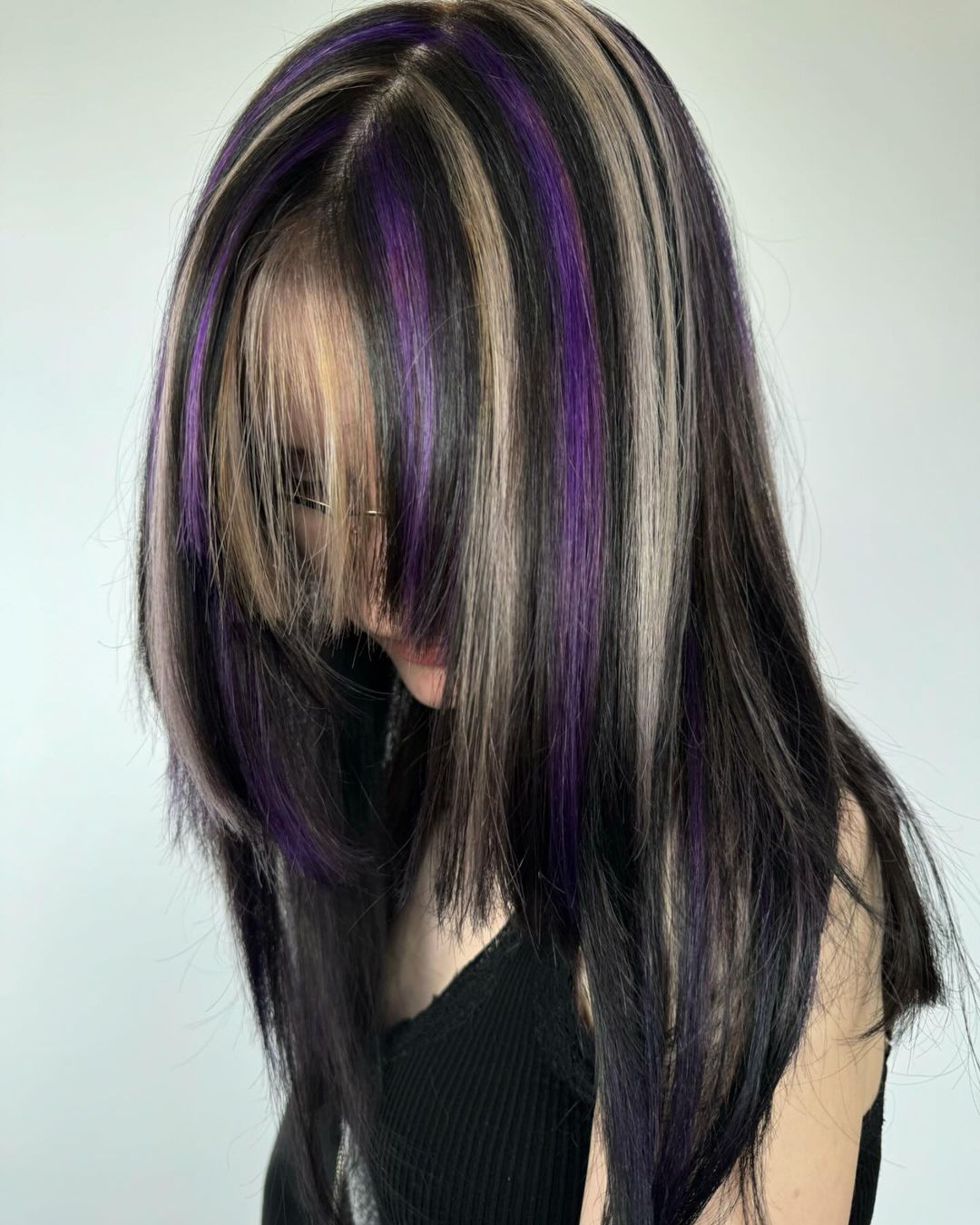 black with blonde and purple highlights