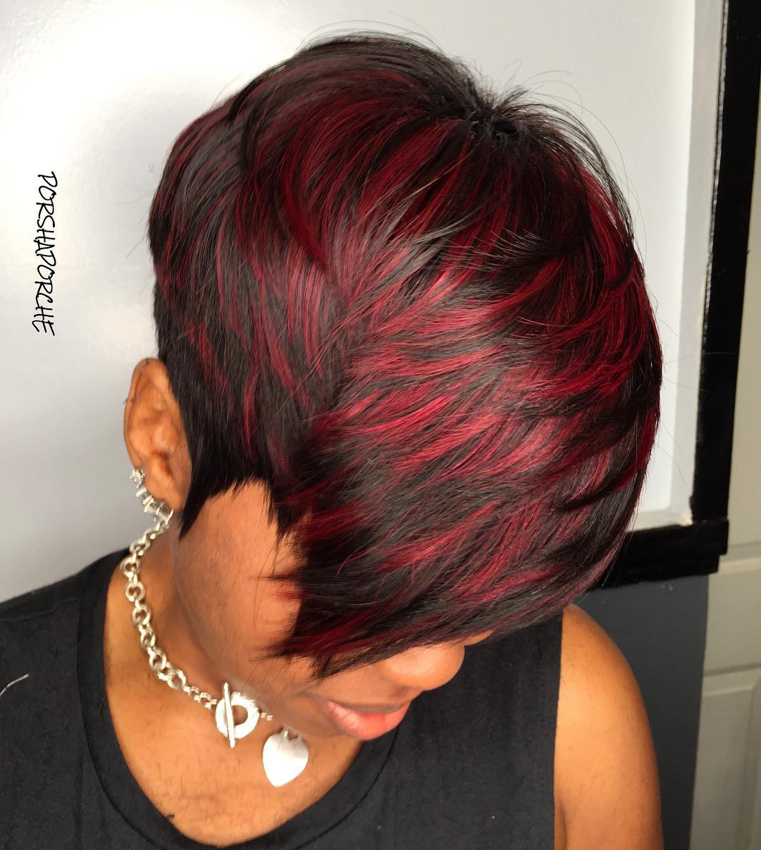 brown pixie cut with cherry red highlights