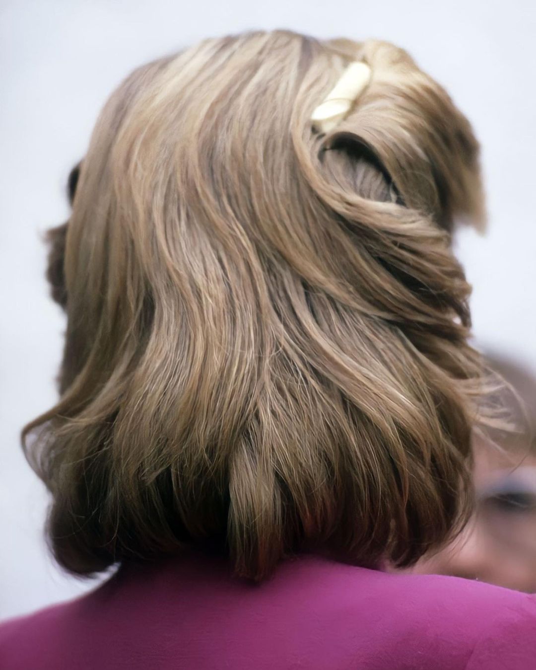 half-up elegant lob with a barrette 