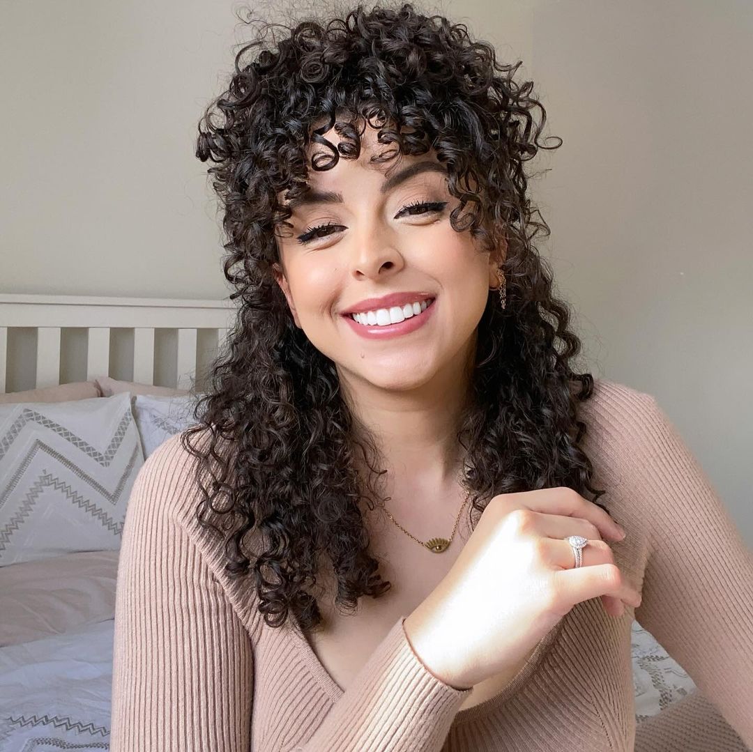 half updo with curly bangs