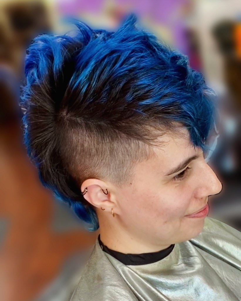 intense blue pixie mohawk with shaved sides